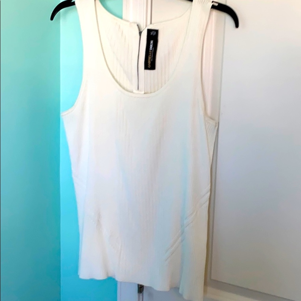White sleeveless shirt.